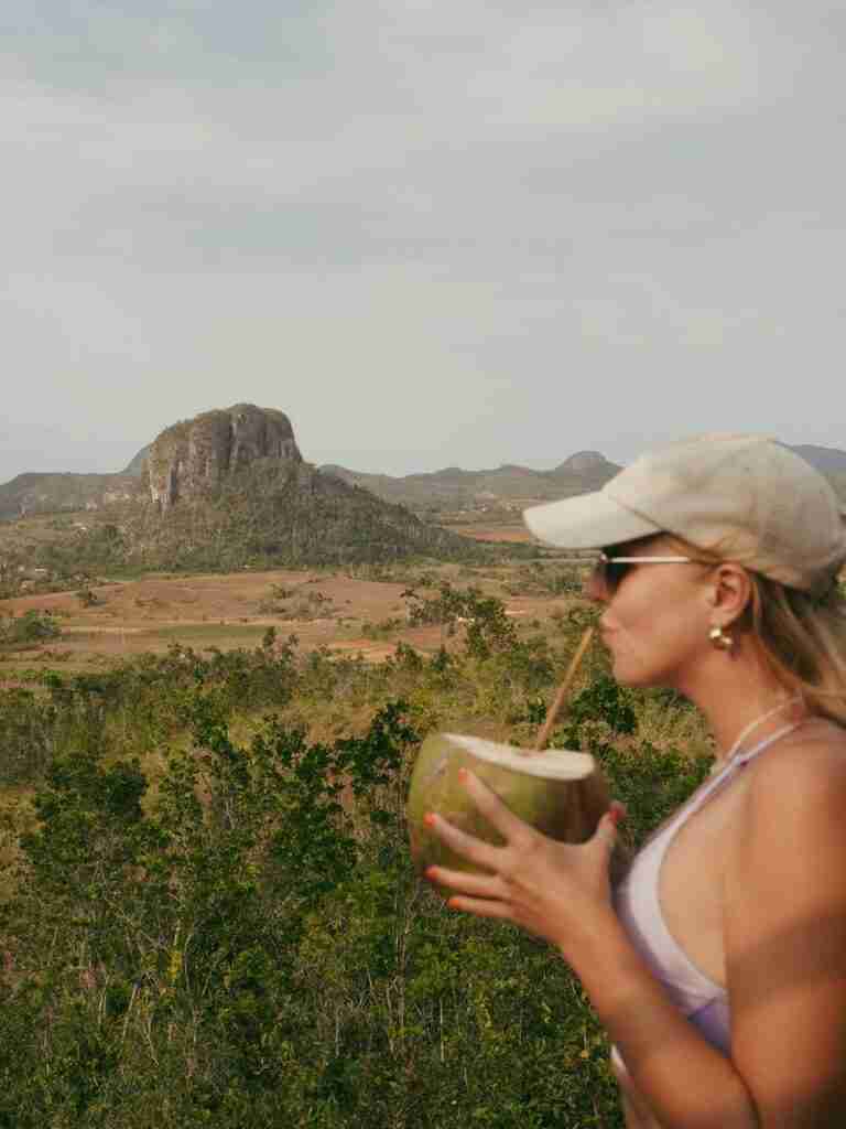 drinking coconut in vinales valley travel to cuba