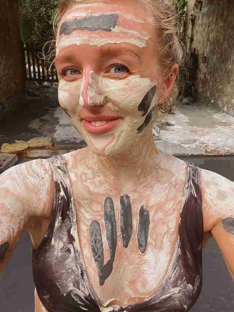 using the mud mask on our faces at sulphur springs in st lucia one of the best things to do in soufriere