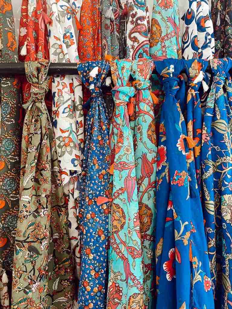 A selection of colourful patterned and paisley scarfs at Castries Central Market