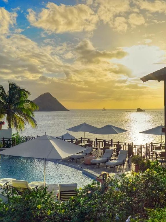 sunset view from cap estate resort showcasing where to stay in st lucia